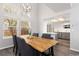Light-filled dining room with modern light fixture and open view to the updated kitchen at 12742 Vrain St, Broomfield, CO 80020
