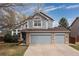 Charming two-story home with a two-car garage, mature trees, and well-maintained landscaping at 12742 Vrain St, Broomfield, CO 80020