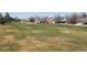 Aerial view of the neighborhood, showcasing a large green field and residential houses at 12742 Vrain St, Broomfield, CO 80020