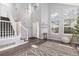 Bright foyer with vaulted ceilings, wood floors, staircase, and lots of natural light at 12742 Vrain St, Broomfield, CO 80020