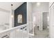 Well-lit hallway with high ceilings, modern light fixtures, and access to bedrooms and closets at 12742 Vrain St, Broomfield, CO 80020
