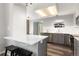 Updated kitchen with stainless steel appliances, white subway tile backsplash, and breakfast bar at 12742 Vrain St, Broomfield, CO 80020
