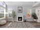 Living room features a cozy fireplace, light-colored walls, and wood laminate flooring at 12742 Vrain St, Broomfield, CO 80020