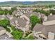 Scenic aerial view of townhomes in a well-maintained community with mountain backdrop at 9692 W Coco Cir # 304, Littleton, CO 80128