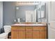 Bathroom with a double sink vanity and a large mirror, creating a functional and stylish space at 9692 W Coco Cir # 304, Littleton, CO 80128