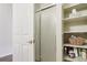Bright bathroom featuring a shower and built-in shelves for storage, keeping your essentials neatly organized at 9692 W Coco Cir # 304, Littleton, CO 80128