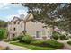 Charming townhome featuring stone accents, neutral siding, and landscaped walkway at 9692 W Coco Cir # 304, Littleton, CO 80128