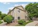 Attractive townhome with neutral siding, stone accents, and a landscaped yard at 9692 W Coco Cir # 304, Littleton, CO 80128