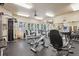 Well-equipped gym with various machines, weights, and exercise equipment for fitness at 9692 W Coco Cir # 304, Littleton, CO 80128