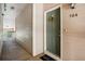 Hallway leading to unit 304, with a decorative wreath on the door at 9692 W Coco Cir # 304, Littleton, CO 80128