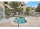 Relaxing spa area with landscaped surroundings and building in the background at 9692 W Coco Cir # 304, Littleton, CO 80128