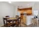 Eat-in kitchen area features modern appliances, light wood cabinetry, and plenty of natural light for enjoyable Gathering dining at 9692 W Coco Cir # 304, Littleton, CO 80128