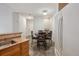 Eat-in kitchen with light colored cabinets, modern appliances, and dining table with chairs at 9692 W Coco Cir # 304, Littleton, CO 80128
