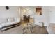 Inviting living room leading to a dining area and kitchen, with modern decor at 9692 W Coco Cir # 304, Littleton, CO 80128