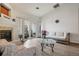 Bright living room featuring a fireplace and access to outdoor balcony at 9692 W Coco Cir # 304, Littleton, CO 80128
