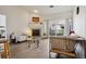 Bright living room with fireplace and sliding doors to outdoor balcony at 9692 W Coco Cir # 304, Littleton, CO 80128