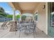 Relaxing covered patio area with ample seating, great for outdoor gatherings at 9692 W Coco Cir # 304, Littleton, CO 80128