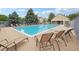 Inviting community pool with lounge chairs, perfect for relaxation and recreation at 9692 W Coco Cir # 304, Littleton, CO 80128