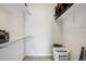 Spacious walk-in closet with shelving and ample storage options, keeping your wardrobe organized at 9692 W Coco Cir # 304, Littleton, CO 80128