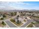 Expansive aerial view showcases the property's location and neighborhood, with scenic mountain backdrop at 15907 W 72Nd Dr, Arvada, CO 80007