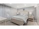 Serene bedroom with soft lighting, neutral tones, and a comfortable bed, creating a peaceful retreat at 15907 W 72Nd Dr, Arvada, CO 80007