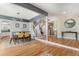 Spacious dining area leads to a staircase and front entrance, creating an inviting flow at 15907 W 72Nd Dr, Arvada, CO 80007