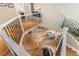 View of a winding staircase with wrought iron railings and a chandelier at 15907 W 72Nd Dr, Arvada, CO 80007