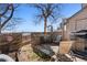 Cozy backyard patio with a privacy fence, chairs, and mature trees offering nice shade at 17467 E Rice Cir # C, Aurora, CO 80015