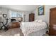 Cozy bedroom with soft lighting, warm carpets, and ample space for relaxation and personal touches at 17467 E Rice Cir # C, Aurora, CO 80015