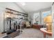 Bright bedroom featuring natural light from skylight, a desk area and an area for exercise at 17467 E Rice Cir # C, Aurora, CO 80015