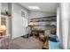 Bright bedroom featuring natural light from skylight, a desk area and an area for exercise at 17467 E Rice Cir # C, Aurora, CO 80015