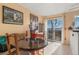 Cozy dining area featuring natural light and slider door access at 17467 E Rice Cir # C, Aurora, CO 80015