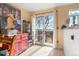 Sunny dining area with a view, a buffet, and access to the outdoors at 17467 E Rice Cir # C, Aurora, CO 80015