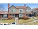 Charming townhome with brick and siding exterior, featuring a well-manicured front yard and inviting entryway at 17467 E Rice Cir # C, Aurora, CO 80015