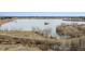 A beautiful lake view with walking trail and an island offering scenic outdoor recreation at 17467 E Rice Cir # C, Aurora, CO 80015