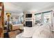Inviting living room with a fireplace, large mirror, and ample natural light at 17467 E Rice Cir # C, Aurora, CO 80015