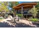 Backyard featuring a covered deck with seating, dining table, barbecue grill, patio and a peaceful outdoor space at 4645 Quitman St, Denver, CO 80212