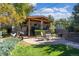 Backyard featuring a covered deck with seating, dining table, barbecue grill, patio and a peaceful outdoor space at 4645 Quitman St, Denver, CO 80212