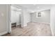 Unfurnished basement room with closet, wood flooring, and neutral walls, ready to customize at 4645 Quitman St, Denver, CO 80212
