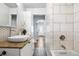 Bright bathroom features a modern vessel sink, neutral countertops, and tiled shower at 4645 Quitman St, Denver, CO 80212