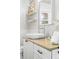 Bright bathroom features a modern vessel sink, neutral countertops, and floating shelves at 4645 Quitman St, Denver, CO 80212