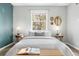 This neutral bedroom features end tables with lamps, minimalist decor, and a window to the outside at 4645 Quitman St, Denver, CO 80212