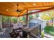 Inviting covered deck featuring wood ceiling, outdoor seating, and stylish decor perfect for relaxation and entertaining outdoors at 4645 Quitman St, Denver, CO 80212