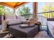 Inviting covered deck featuring wood ceiling, outdoor seating, curtains and stylish decor perfect for relaxation and entertaining at 4645 Quitman St, Denver, CO 80212