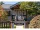 Charming home featuring a covered entryway and well-maintained landscaping, and a white front door with glass inset at 4645 Quitman St, Denver, CO 80212