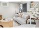 Stylish living room features a white sofa, modern decor, and plenty of natural light from the large windows at 4645 Quitman St, Denver, CO 80212