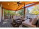 Covered patio with outdoor seating, wooden ceiling, and view of the backyard at 4645 Quitman St, Denver, CO 80212