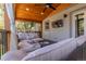 Relaxing covered patio with outdoor furniture, a ceiling fan, and a backyard view at 4645 Quitman St, Denver, CO 80212