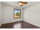 A bright bedroom with hardwood floors and a ceiling fan at 5250 S Huron Way # 3-205, Littleton, CO 80120