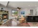 Inviting living room features a cozy fireplace, ceiling fan and stylish furnishings for a relaxing ambiance at 5250 S Huron Way # 3-205, Littleton, CO 80120